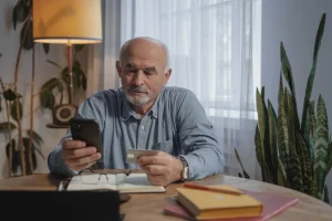 senior with phone